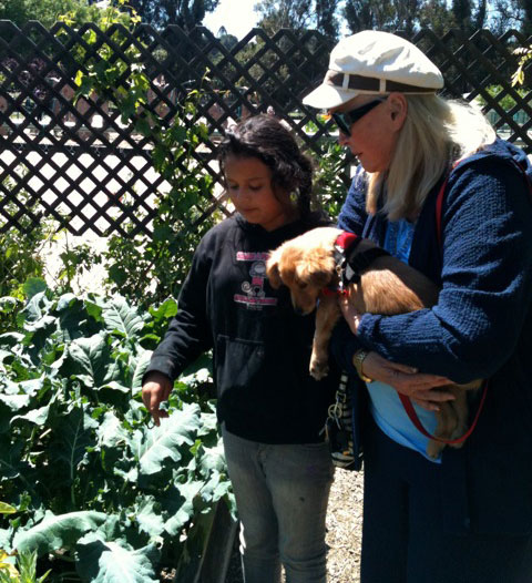 Diane Ladd with student and puppy